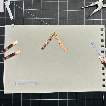 I then put two pieces of tape down to put the light over them.