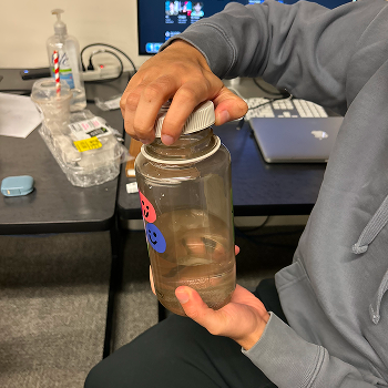 Interaction: Opening a bottle.