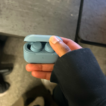 Interaction: Opening an earbuds case.