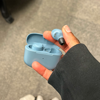 Interaction: Taking out an earbud.